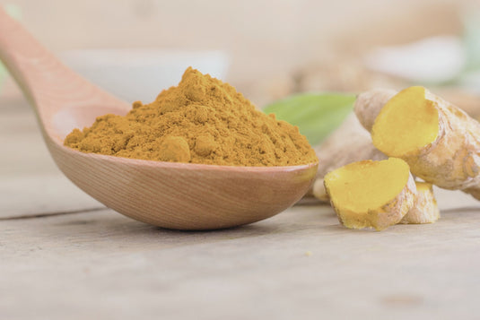Golden turmeric powder and root - natural anti-inflammatory spice with curcumin by Junovu